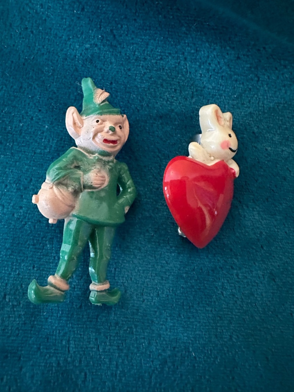 2 celluloid vintage pins. The leprechaun one is 1930-1940s
